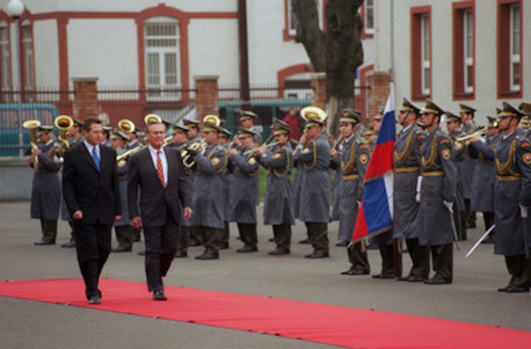 Slovakian Minister of Defense Ivan Simko (left) escorts Secretary of Defense Donald H. Rumsfeld as he inspects the honor guard at the Ministry of Defense complex in Bratislava, Slovakia, on Nov. 22, 2002. Rumsfeld flew to Slovakia immediately after the conclusion of the NATO Summit in Prague, Czech Republic. Rumsfeld will hold bilateral security discussions with Simko and is scheduled to meet with President Rudolf Schuster and members of the Slovak Parliament. 