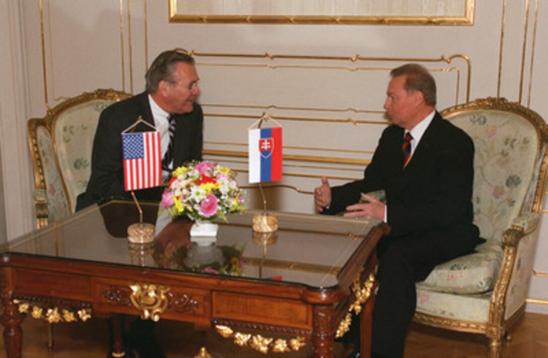 Secretary of Defense Donald H. Rumsfeld (left) meets with President of the Slovak Republic Rudolf Schuster (right) at the Presidential Palace in Bratislava on Nov. 22, 2002. Rumsfeld flew to Bratislava following the NATO Summit in Prague, Czech Republic, to offer his congratulations to President Schuster and other senior government officials for Slovakia's invitation to join NATO. 