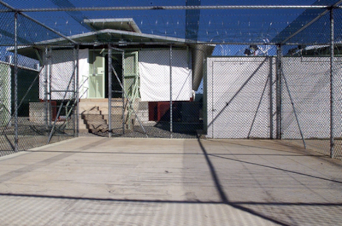 A Camp Delta recreation and exercise area at Guantanamo Bay, Cuba. The detention block is shown with sunshades drawn on December 3, 2002. 