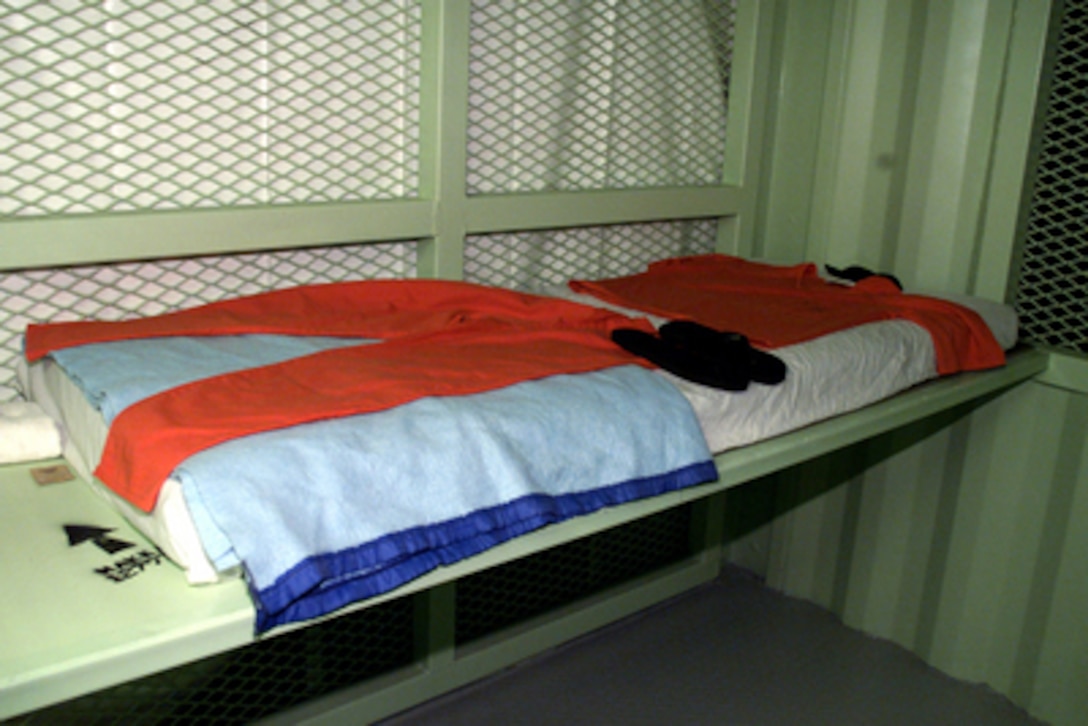 Comfort items issued to detainees at Camp Delta, Guantanamo Bay, Cuba, include: mattress, sheet, blanket, prayer mat, two-piece suit, flip-flop shoes, prayer cap, wash cloth and towel, and a salt packet for seasoning food. 