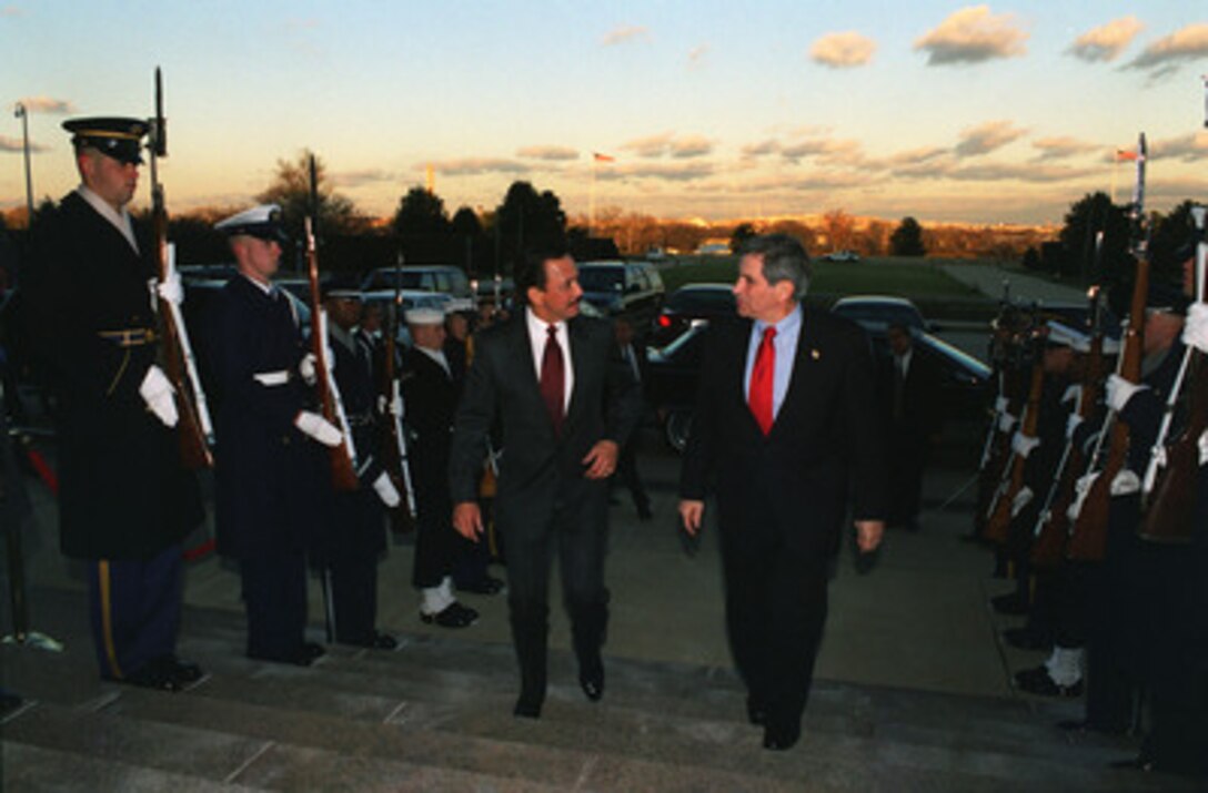 Deputy Secretary of Defense Paul D. Wolfowitz escorts his Majesty Hassanal Bolkiah, the sultan of Brunei, into the Pentagon on Dec. 16, 2002. The two leaders are meeting to discuss defense issues of mutual interest. 
