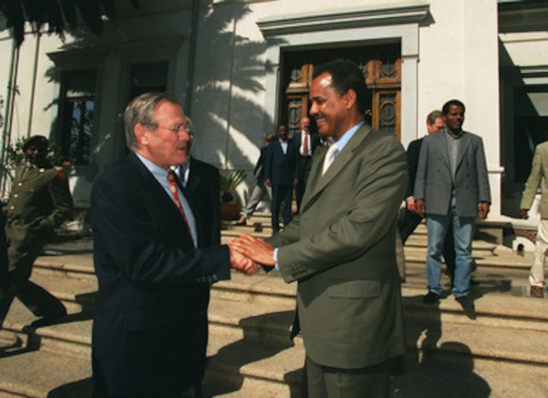 Secretary of Defense Donald H. Rumsfeld is bid farewell by President Isaias Afwerki as he departs Denden Club, Asmara, Eritrea, on Dec. 10, 2002. Rumsfeld traveled to Eritrea to meet with leaders concerning defense issues and the war on terrorism. 