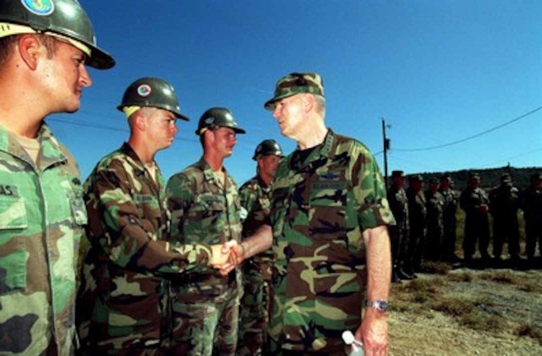 Chairman of the Joint Chiefs of Staff Gen. Richard B. Myers, U.S. Air Force, meets with U.S. Navy Seabees at Camp X-Ray in Guantanamo Bay, Cuba, on Jan. 27, 2002. The Seabees are expanding facilities for Taliban and al Qaeda detainees brought from Afghanistan. Myers accompanied Secretary of Defense Donald H. Rumsfeld to see first hand the camp conditions and visit Joint Task Force 160 troops. 