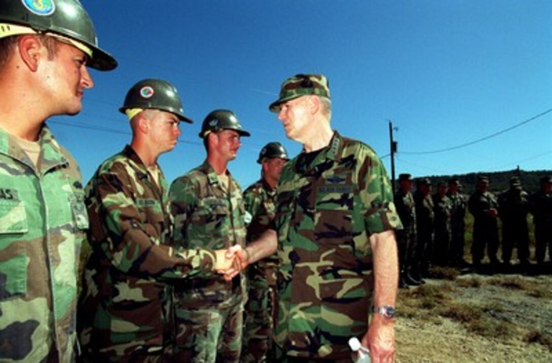 Chairman of the Joint Chiefs of Staff Gen. Richard B. Myers, U.S. Air Force, meets with U.S. Navy Seabees at Camp X-Ray in Guantanamo Bay, Cuba, on Jan. 27, 2002. The Seabees are expanding facilities for Taliban and al Qaeda detainees brought from Afghanistan. Myers accompanied Secretary of Defense Donald H. Rumsfeld to see first hand the camp conditions and visit Joint Task Force 160 troops. 