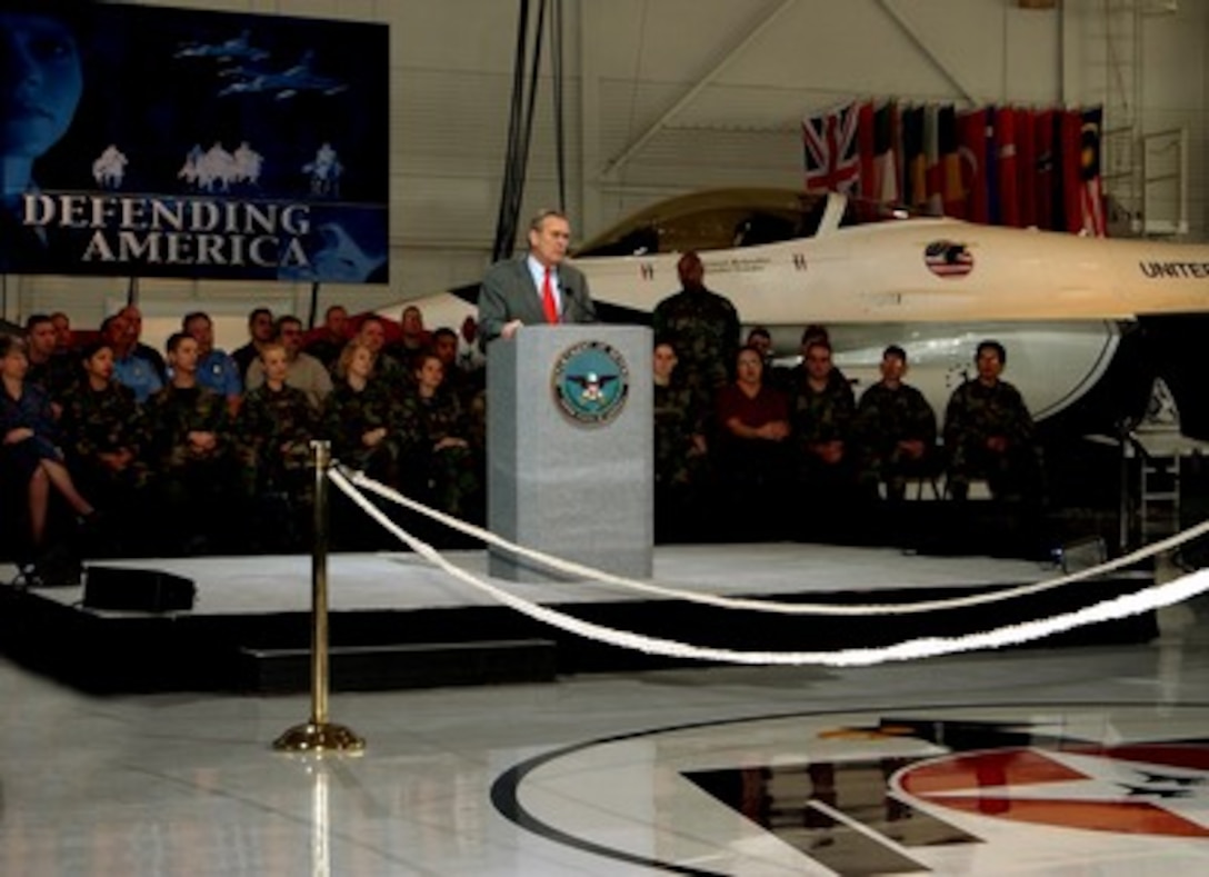 Secretary of Defense Donald H. Rumsfeld responds to a question during a town hall meeting at Nellis Air Force Base, Nev., on Feb. 20, 2002. Rumsfeld is visiting Nellis to meet the troops and the local commanders stationed there. 