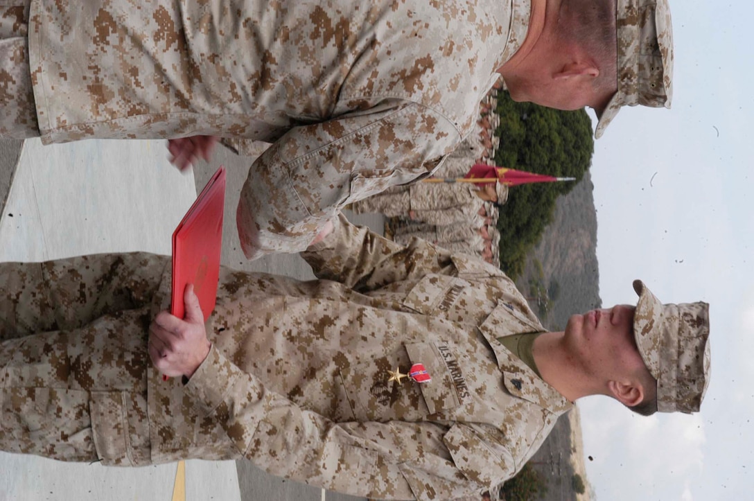 Cpl. Charles A. Williams Jr., vehicle commander, 1st Battalion, 5th Marine Regiment, 1st Marine Division, was awarded the Bronze Star Medal Friday from Col. Larry D. Nicholson, Regimential Commanding Officer, 5th Marine Regiment.
