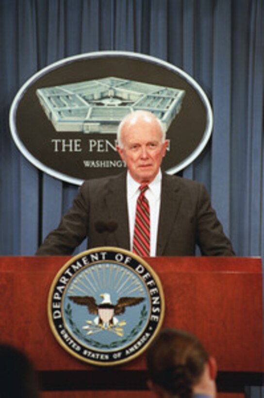 Principal Deputy Assistant Secretary of Defense for Special Operations and Low-Intensity Conflict Robert Andrews listens to a reporter's question during a Pentagon press briefing on Special Operations capabilities Dec. 12, 2001. 