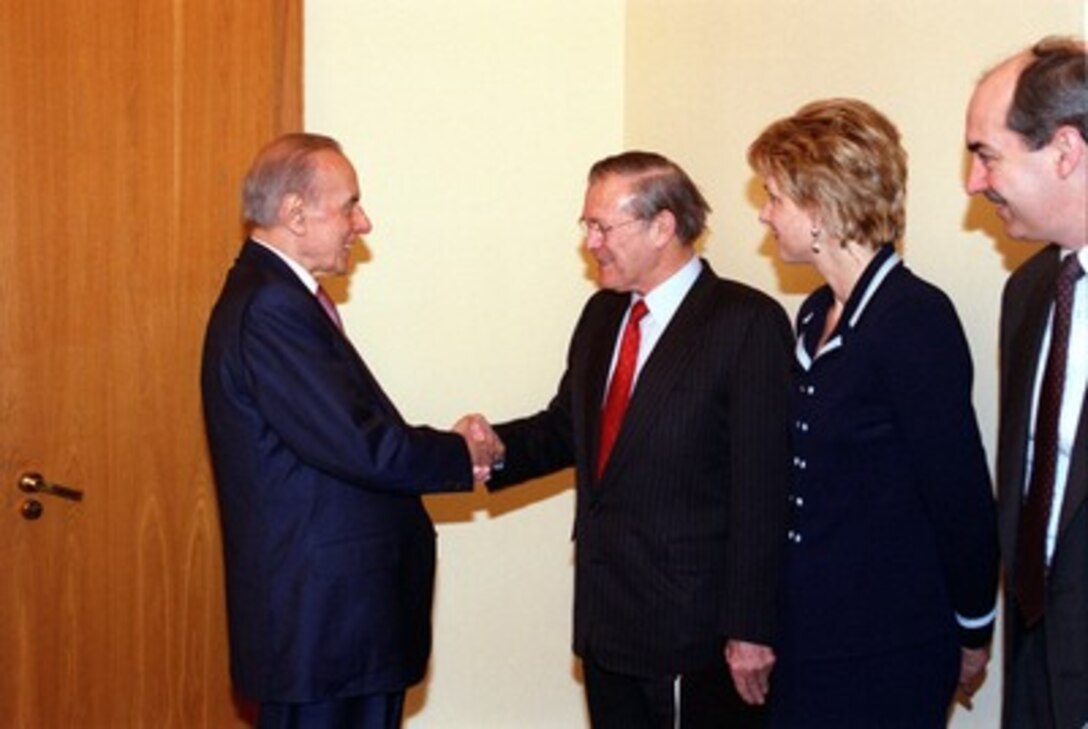 President Heydar Aliyev (left) greets Secretary of Defense Donald H. Rumsfeld at the Presidential Palace in Baku, Azerbaijan, on Dec. 15, 2001. Rumsfeld is meeting with leaders of the Caucasus region to establish military-to-military links with those countries. Accompanying Rumsfeld is Assistant Secretary of Defense, Public Affairs, Victoria Clarke and Assistant Secretary of Defense for International Security Policy J. D. Crouch. 