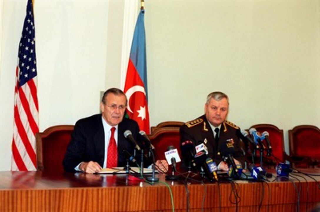 Secretary of Defense Donald H. Rumsfeld responds to a reporter's question during a joint press briefing with Minister of Defense Colonel General Safar Abiyev at the Presidential Palace in Baku, Azerbaijan, on Dec. 15, 2001. Rumsfeld is meeting with leaders of the Caucasus region to establish military-to-military links with those countries. 