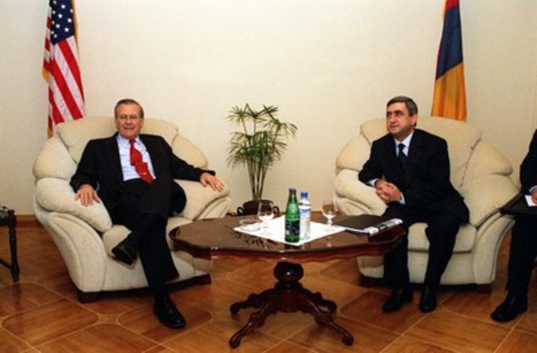 Secretary of Defense Donald H. Rumsfeld (left) meets with Armenian Minister of Defense Serge Saksian in Yerevan, Armenia, on Dec. 15, 2001. Rumsfeld is meeting with leaders of the Caucasus region to establish military-to-military links with those countries. 