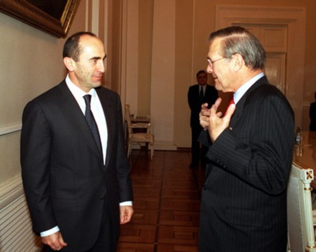 Armenian President Robert Kocharian (left) meets with Secretary of Defense Donald H. Rumsfeld at the Presidential Palace in Yerevan, Armenia, on Dec. 15, 2001. Rumsfeld is meeting with leaders of the Caucasus region to establish military-to-military links with those countries. 