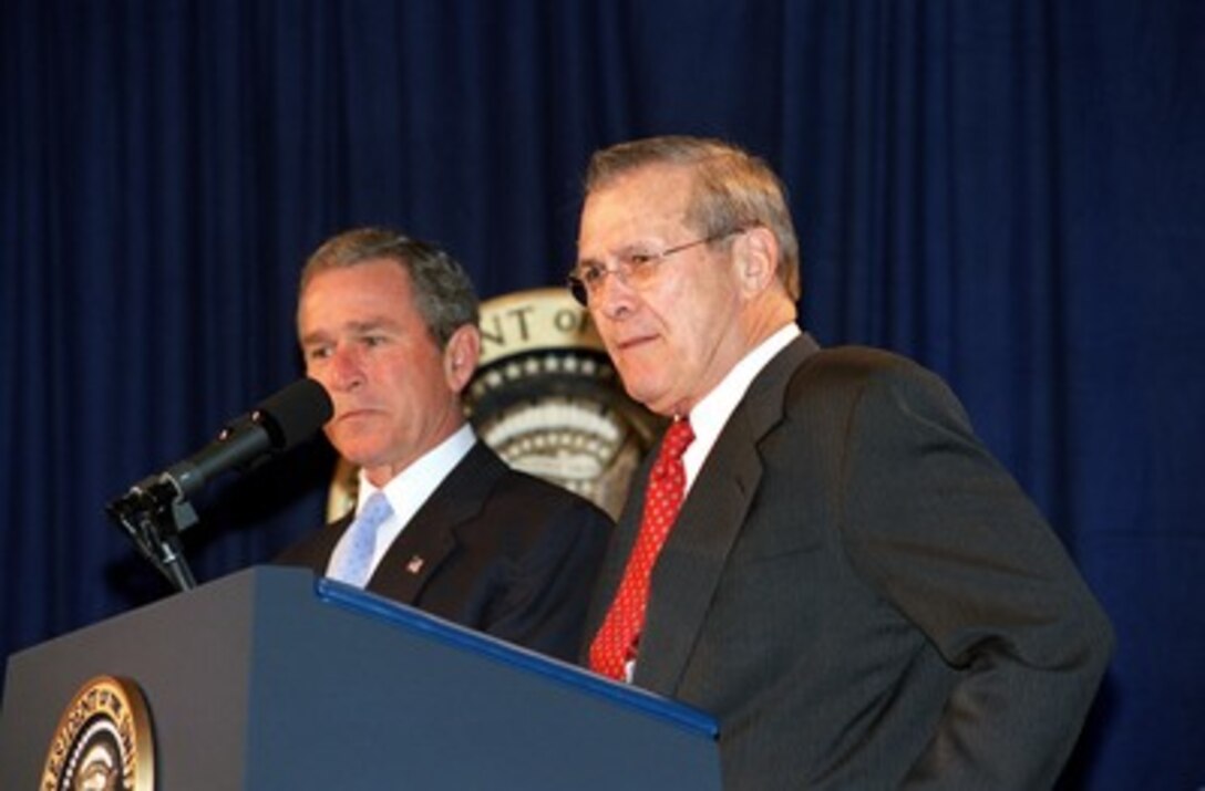 Secretary of Defense Donald H. Rumsfeld introduces President George W. Bush to the audience in the Pentagon auditorium on Jan. 10, 2002. Bush is at the Pentagon to sign the Defense Appropriations Bill. 