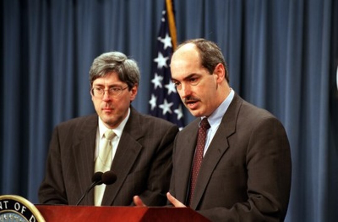 Assistant Secretary of Defense, International Security Policy, J.D. Crouch (right), and Under Secretary of Defense for Policy Douglas Feith (left) brief the press at the Pentagon on Jan. 16, 2002. Crouch and Feith discussed their recent meetings with First Deputy Chief of the General Staff General-Colonel Yuriy Nikolayevich Baluyevskiy of the Russian Federation Armed Forces and the Russian delegation on strategic force reductions. 