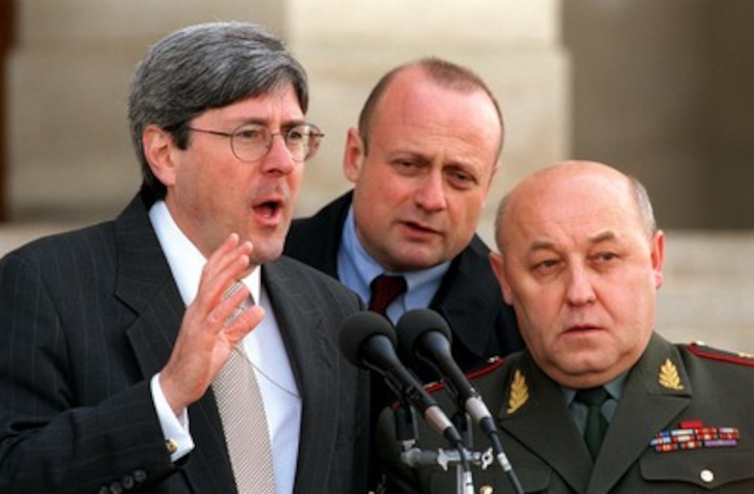 Under Secretary of Defense for Policy Douglas Feith and Gen.-Col. Yuriy Nikolayevich Baluyevskiy, 1st deputy chief of the Russian General Staff, hold a joint press conference at the Pentagon on Jan. 16, 2002. Feith and Baluyevskiy met earlier to discuss a range of issues including cooperative efforts to combat terrorism and the proliferation of weapons of mass destruction, missile defense cooperation, and bilateral strategic offensive weapons reductions. 