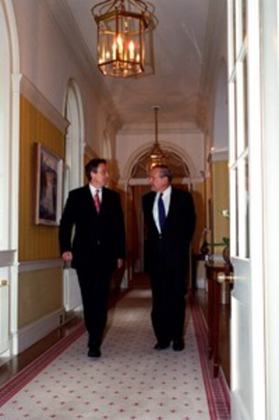 Prime Minister Tony Blair (left) escorts Secretary of Defense Donald H. Rumsfeld to his office at 10 Downing Street, London, England, on June 5, 2002. Rumsfeld is beginning a 10-day tour of nine countries to meet with senior leaders and to visit with U.S. troops deployed abroad. 