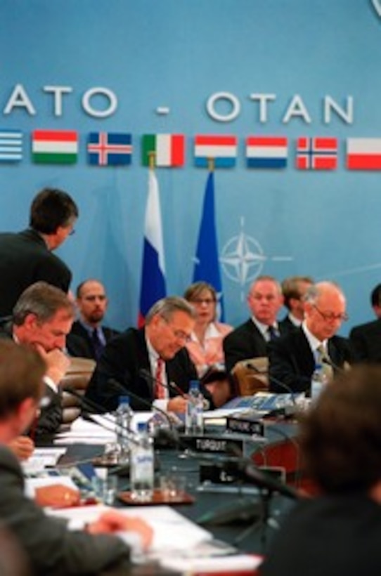 Secretary of Defense Donald H. Rumsfeld attends the NATO Russia Council Meeting of 20 nations at Brussels, Belgium, on June 6, 2002. Rumsfeld is on a 10-day tour of nine countries to meet with senior leaders and to visit with U.S. troops deployed abroad. 