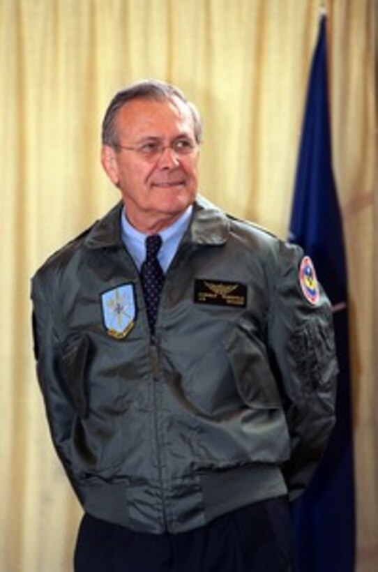 Secretary of Defense Donald H. Rumsfeld is introduced to the multi-national assembly of NATO troops assigned to Geilenkirchen Air Base, Germany, on June 7, 2002. Rumsfeld is on a 10-day tour of nine countries to meet with senior leaders and to visit with U.S. troops deployed abroad. 