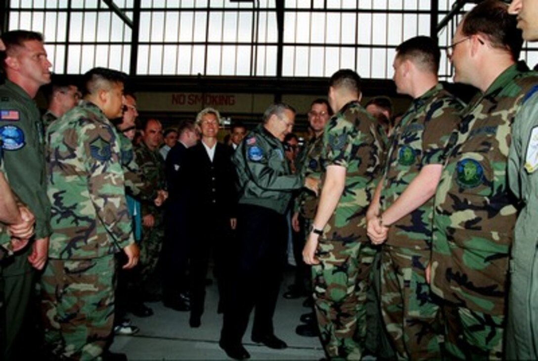 Secretary of Defense Donald H. Rumsfeld (right center) greets a multi-national assembly of NATO troops assigned to Geilenkirchen Air Base, Germany, on June 7, 2002. Rumsfeld is on a 10-day tour of nine countries to meet with senior leaders and to visit with U.S. troops deployed abroad. Minister of Defense of Norway Kristin Krohn Devold (left center) joined Rumsfeld in visiting the base. 