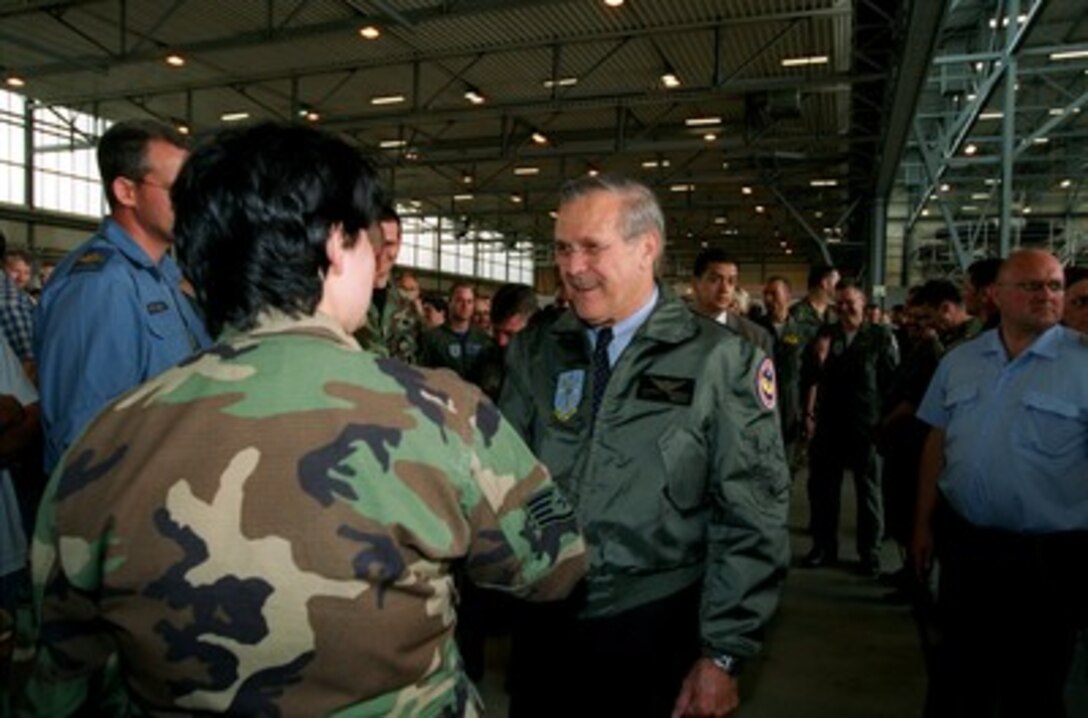 Secretary of Defense Donald H. Rumsfeld greets a U.S. Air Force sergeant assigned to Geilenkirchen Air Base, Germany, on June 7, 2002. Rumsfeld is on a 10-day tour of nine countries to meet with senior leaders and to visit with U.S. troops deployed abroad. 