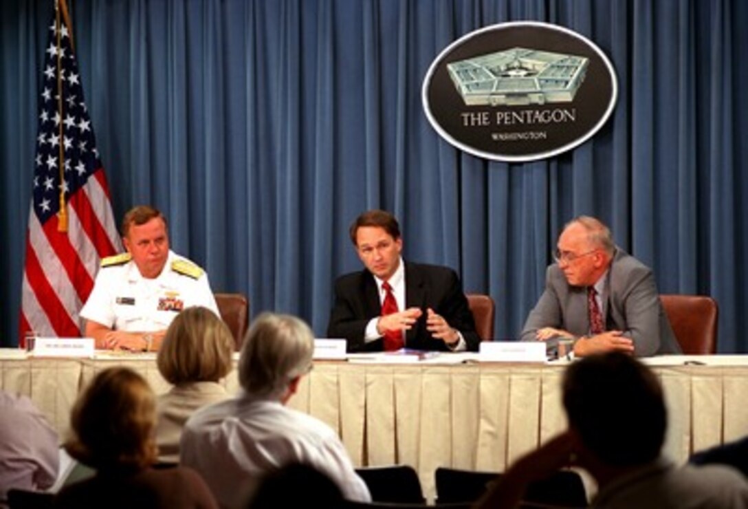 Assistant Secretary of Defense for Health Affairs Dr. William Winkenwerder Jr. (center) responds to a reporter's question during a June 28, 2002, Pentagon press briefing on the resumption of the Department of Defense anthrax immunization program. Winkenwerder was joined by Navy Vice Adm. Gordon S. Holder (left), director for logistics, J-4, the Joint Staff and William F. Raub (right), Ph.D., deputy director, Office of Public Health Preparedness, Department of Health and Human Services for the briefing. 