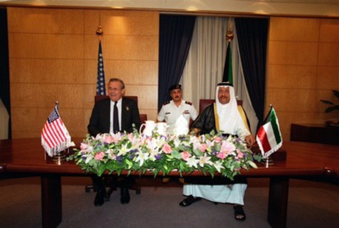 Secretary of Defense Donald H. Rumsfeld meets with Minister of Defense Shayk Jabir Mubarak al-Hamad Al Sabah at the al-Sabah Diwaniya in Kuwait on June 9, 2002. Rumsfeld is on a 10-day tour of nine countries to meet with senior leaders and to visit with U.S. troops deployed abroad. 