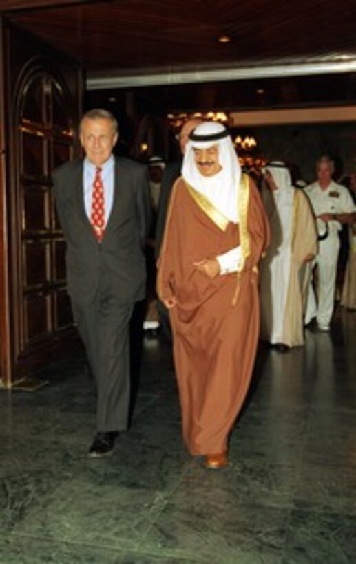Prime Minister Shaikh Khalifa Sullman A-Khalifia, of the Kingdom of Bahrain, escorts Secretary of Defense Donald H. Rumsfeld to his motorcade following their meeting at the minister's office in Manama, Bahrain, on June 10, 2002. Rumsfeld is on a 10-day tour of nine countries to meet with senior leaders and to visit with U.S. troops deployed abroad. 