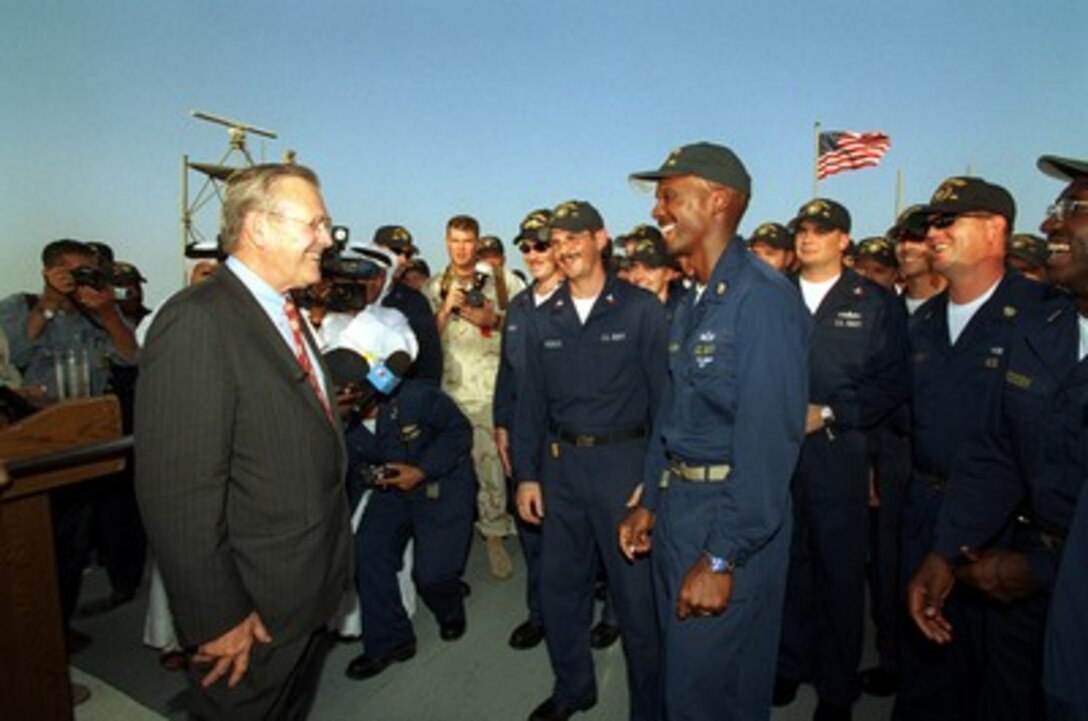 Secretary of Defense Donald H. Rumsfeld talks with sailors aboard the USS Carney (DDG 64) while in port in Bahrain on June 10, 2002. Rumsfeld is on a 10-day tour of nine countries to meet with senior leaders and to visit with U.S. troops deployed abroad. 