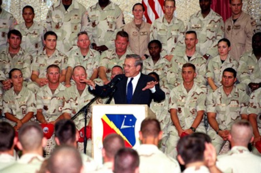 Secretary of Defense Donald H. Rumsfeld addresses U.S. troops at Al Udeid Air Base, Qatar, on June 11, 2002. Rumsfeld is on a 10-day tour of nine countries to meet with senior leaders and to visit with U.S. troops deployed abroad. 