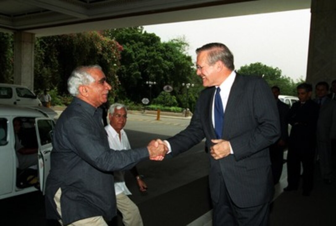 Indian Minister of External Affairs Jaswant Singh (left) is greeted by Secretary of Defense Donald H. Rumsfeld as he arrives for their working luncheon in New Delhi, India, on June 12, 2002. Rumsfeld is on a 10-day tour of nine countries to meet with senior leaders and to visit with U.S. troops deployed abroad. 