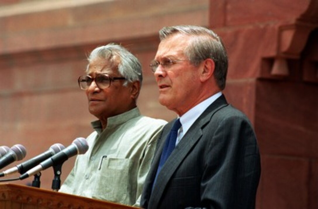 Indian Minister of Defense George Fernandes (left) and Secretary of Defense Donald H. Rumsfeld conduct a joint press conference outside South Block in New Delhi, India, on June 12, 2002. Rumsfeld is on a 10-day tour of nine countries to meet with senior leaders and to visit with U.S. troops deployed abroad. 