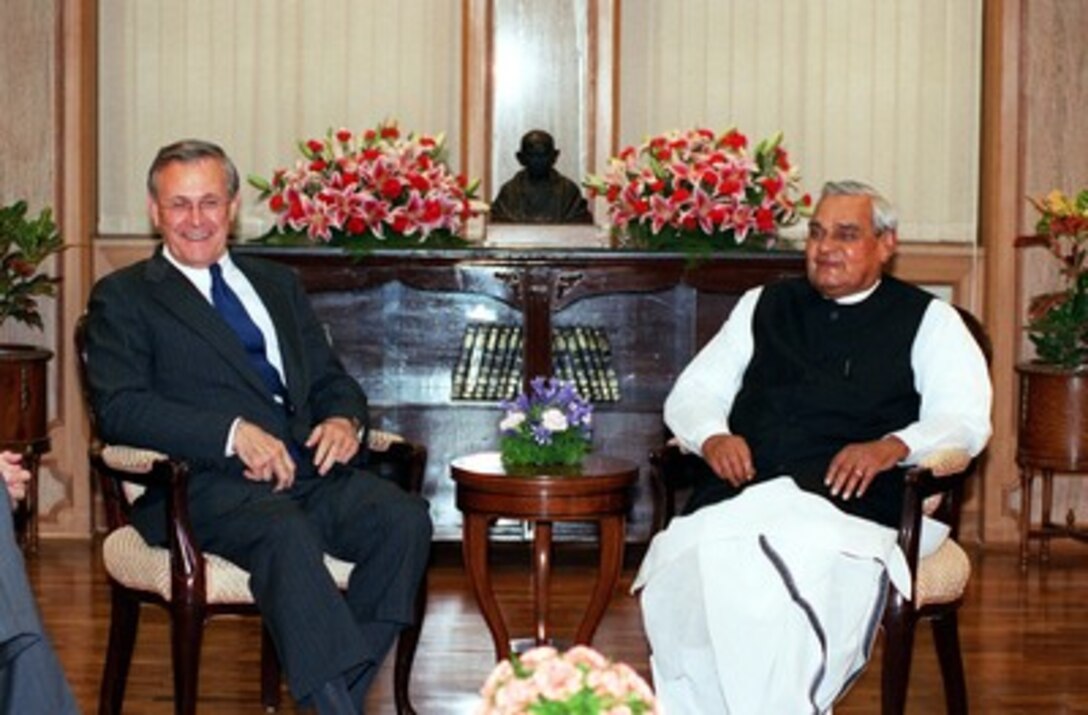 Secretary of Defense Donald H. Rumsfeld (left) meets with Indian Prime Minister Atal Bihari Vajpayee at his New Delhi, India, residence on June 12, 2002. Rumsfeld is on a 10-day tour of nine countries to meet with senior leaders and to visit with U.S. troops deployed abroad. 