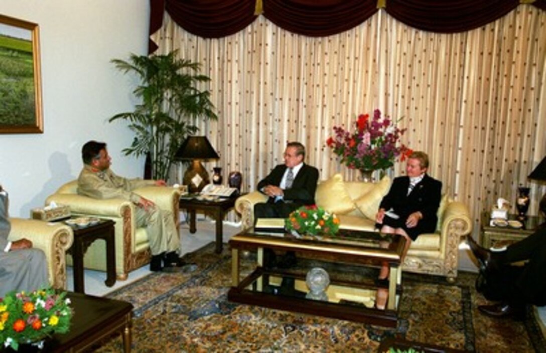 President Pervez Musharraf (left) meets with Secretary of Defense Donald H. Rumsfeld (center) in Islamabad, Pakistan, on June 13, 2002. Charge d' Affaires Nancy Powell (right), of the U.S Embassy, and Indian Minister of Foreign Affairs Abdul Satter joined Musharraf and Rumsfeld for their meeting. Rumsfeld is on a 10-day tour of nine countries to meet with senior leaders and to visit with U.S. troops deployed abroad. 