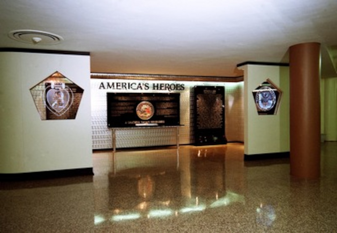 The Pentagon's America's Heroes Memorial is dedicated to the 184 people killed in the Sept. 11, 2001, terrorist attack on the Pentagon. The names of the victims are engraved on black acrylic panels inside the horseshoe-shaped memorial. A book containing photographs and biographies of each of the victims is at the center of the memorial under the "United in Memory" seal. 