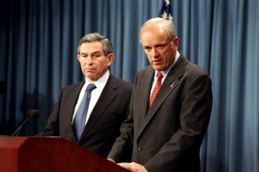 Secretary of the Army Thomas E. White (right) responds to a reporter's question during a Pentagon press briefing with Deputy Secretary of Defense Paul Wolfowitz on May 8, 2002. White and Wolfowitz briefed reporters on the cancellation of the Crusader Artillery System. 