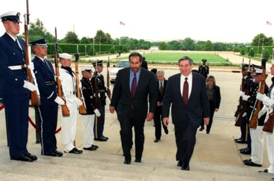 Deputy Secretary of Defense Paul Wolfowitz (right) escorts Minister of Foreign Affairs Shaikh Hamad bin Jasim bin Jabir Al-Thani, of Qatar, into the Pentagon on May 10, 2002. The two leaders will meet to discuss defense issues of mutual interest. 