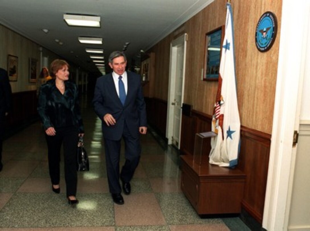 Deputy Secretary of Defense Paul Wolfowitz escorts Her Royal Highness Aisha bin al Hussein, of the Hashemite Kingdom of Jordan into his Pentagon office on May 17, 2002. 