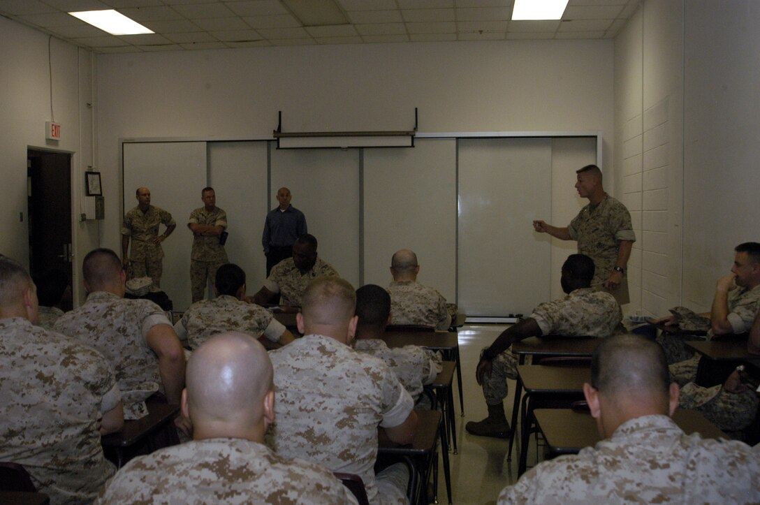Col. Paul Pratt, Assistant Chief of Staff for Operations and Plans, Marine Forces Reserve, addresses the Marines who were part of the first phase of evacuees from MFR New Orleans. Hurricane Gustav has forced these Marines and their families to relocate to Naval Air Station/Joint Reserve Base, Fort Worth. These Marines are representatives from their units chosen to set up shop in preparation of the rest of their coworkers.