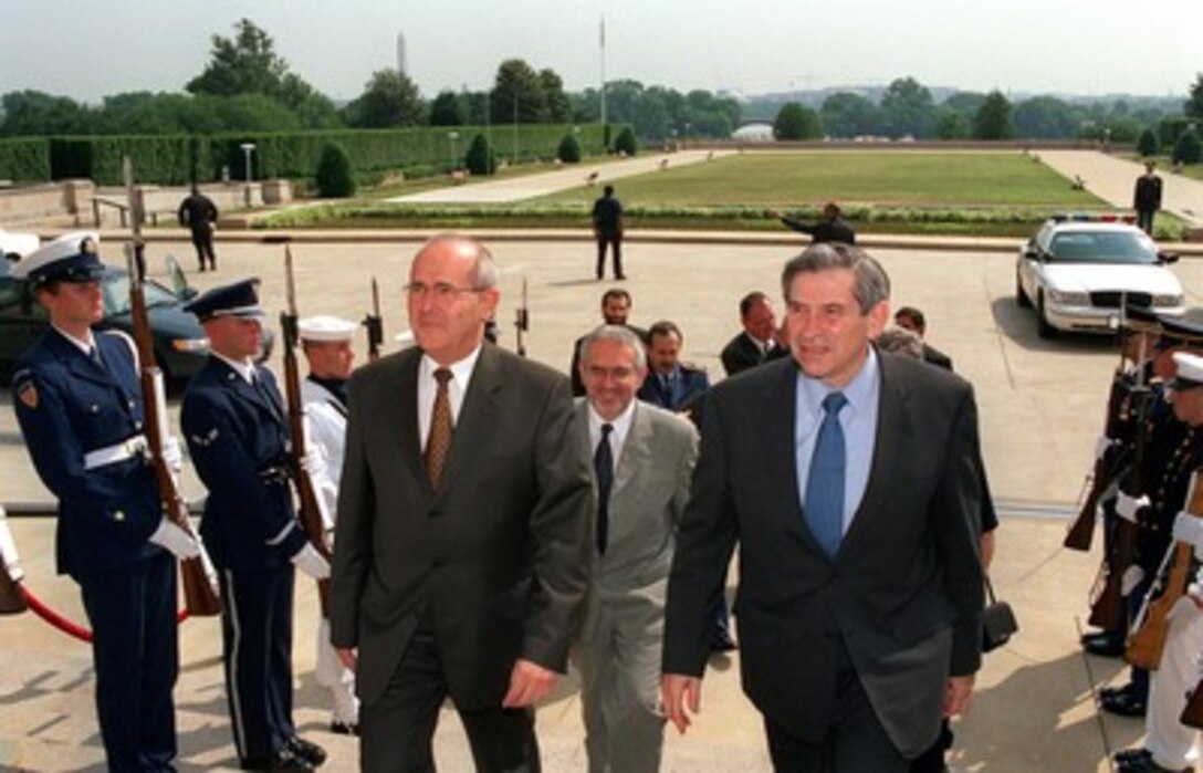 Deputy Secretary of Defense Paul Wolfowitz (right) escorts Slovakian Minister of Defense Jozef Stank into the Pentagon on June 6, 2002. Wolfowitz and Stank will meet to discuss a range of bilateral security issues. 