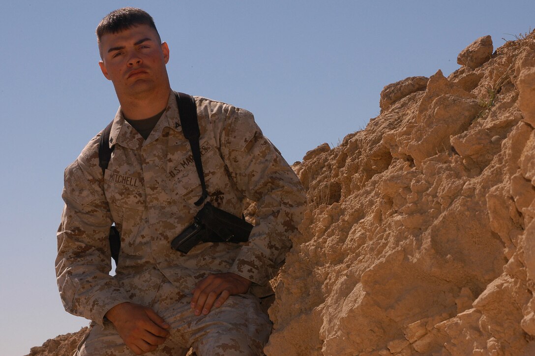 AL ASAD, Iraq (March 19, 2005) - Lance Cpl. Brandon M. Mitchell is currently serving in Iraq with Marine Wing Headquarters Squadron 2. Mitchell graduated from Queensbury High School in 2003 and joined the Marine Corps shortly after. He volunteered to deploy to Iraq, and is currently working in his squadron's operations office.