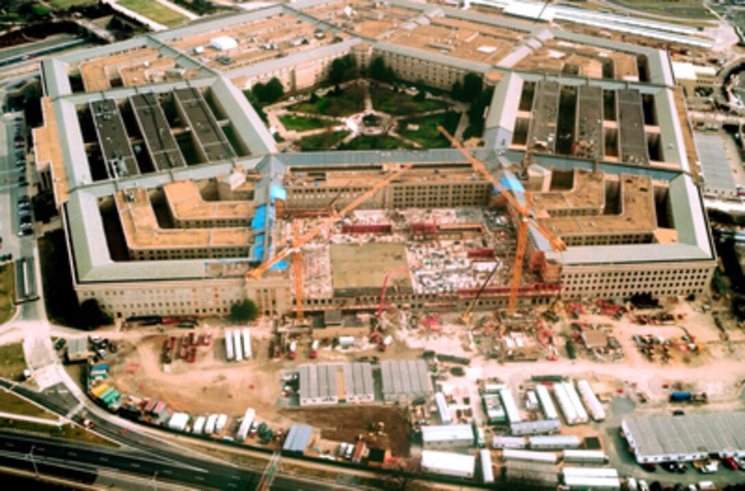 Reconstruction of the Pentagon continues nearly around-the-clock as construction crews pour concrete for floors and walls on Feb. 6, 2002, to replace those damaged in the Sept. 11, 2001, terrorist attack on the building. 