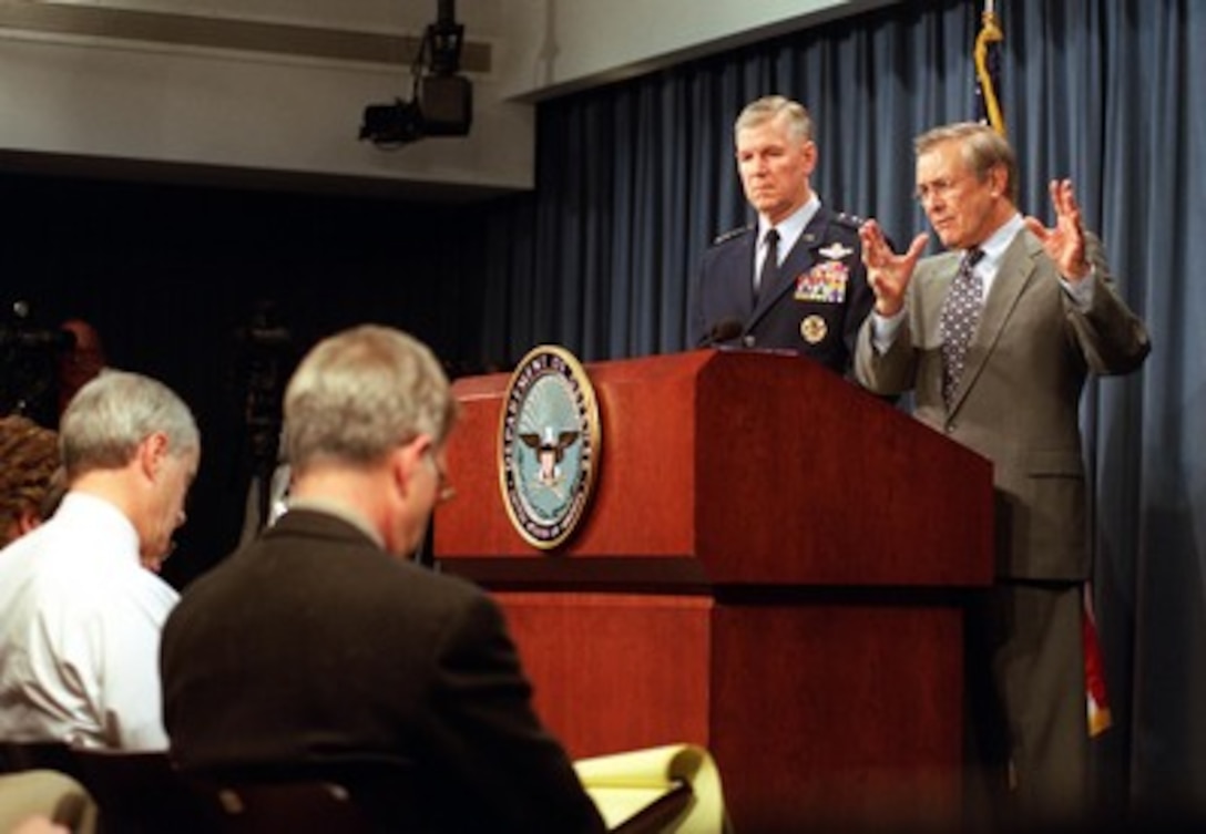 Secretary of Defense Donald H. Rumsfeld and Chairman of the Joint Chiefs of Staff Gen. Richard B. Myers, U.S. Air Force, brief reporters at the Pentagon on the latest developments in the war on terrorism on Feb. 21, 2002. 