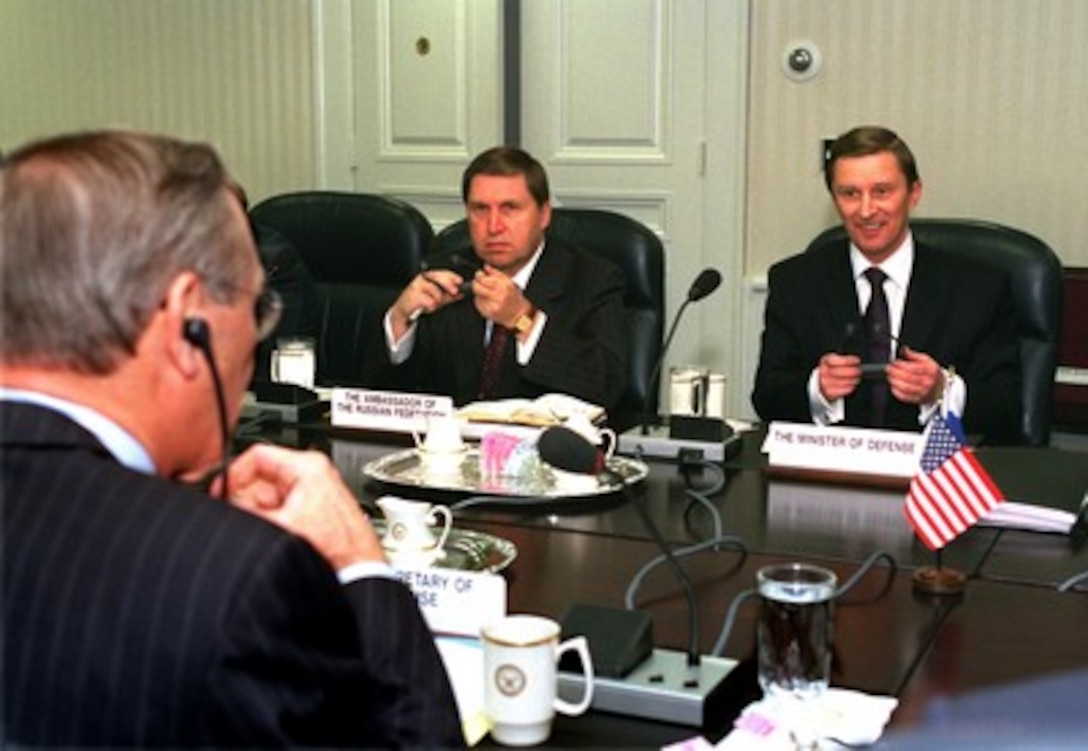 Russian Minister of Defense Sergey Ivanov (right) meets with Secretary of Defense Donald H. Rumsfeld (foreground) in the Pentagon on March 12, 2002. The two men are holding meetings throughout the day, both privately and with senior advisors, to review a broad range of security issues of mutual interest. Also participating in the talks is Russian Ambassador to the United States Yuriy Ushakov (center). 