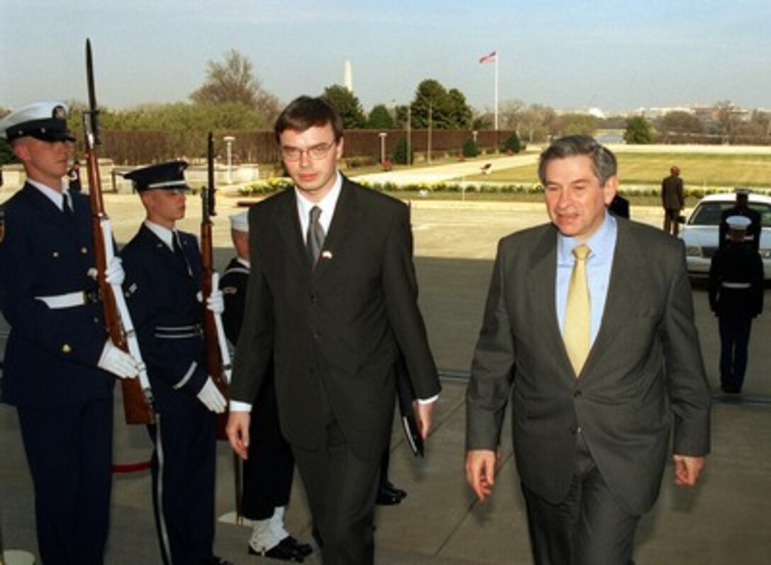 Estonian Minister of Defense Sven Mikser (left) is escorted by Deputy Secretary of Defense Paul Wolfowitz through an honor cordon and into the Pentagon on March 14, 2002. Mikser and the defense ministers from Latvia and Lithuania will meet with Wolfowitz to discuss regional security issues of interest to all four nations. 