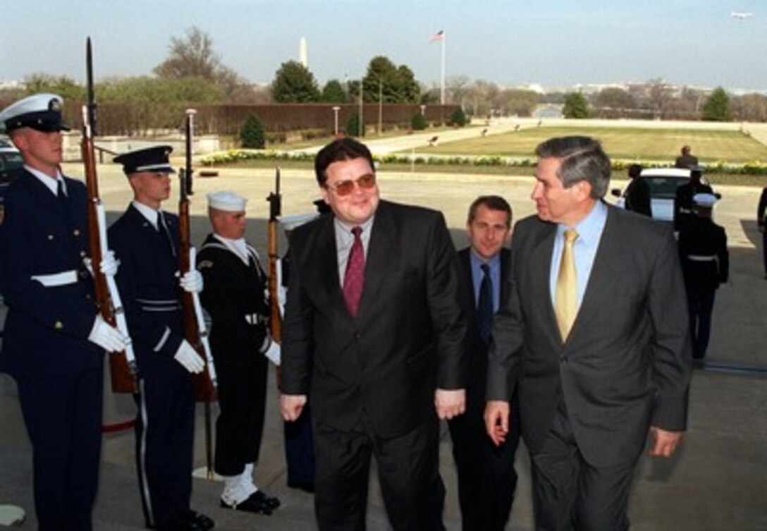 Lithuanian Minister of Defense Linas Linkevicius (left) is escorted by Deputy Secretary of Defense Paul Wolfowitz through an honor cordon and into the Pentagon on March 14, 2002. Linkevicius and the defense ministers from Estonia and Latvia and will meet with Wolfowitz to discuss regional security issues of interest to all four nations. 