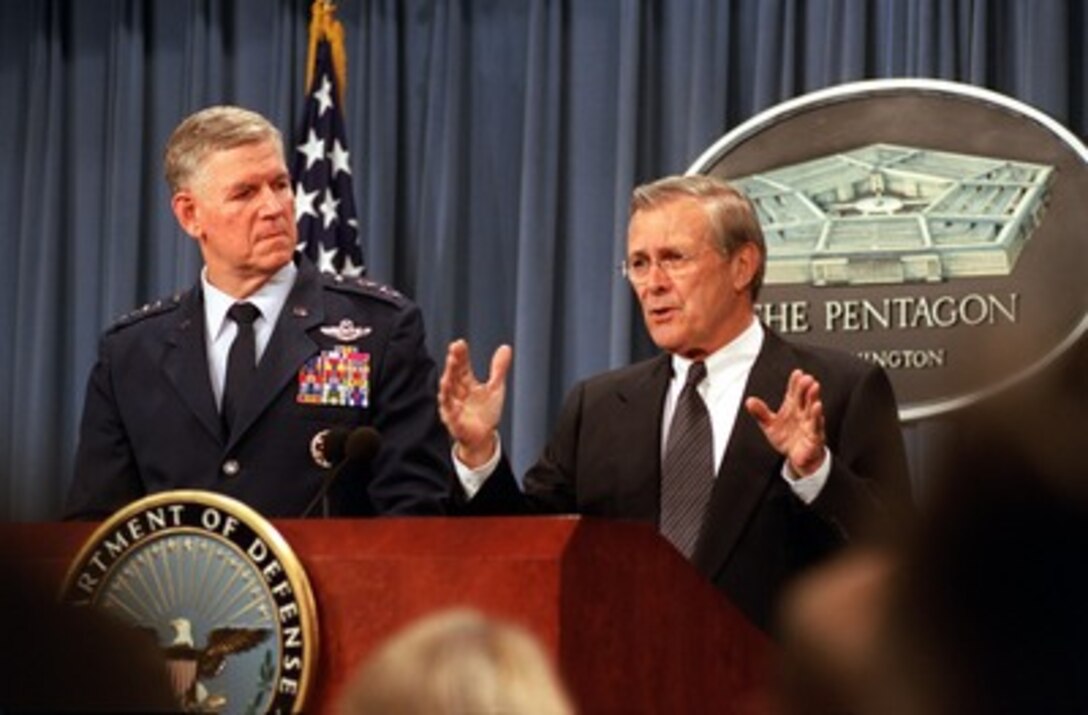 Secretary of Defense Donald H. Rumsfeld responds to a reporter's question concerning U.S. participation in the International Security Assistance Force in Afghanistan during a Pentagon press briefing on March 25, 2002. Chairman of the Joint Chiefs of Staff Gen. Richard B. Myers, U.S. Air Force, joined Rumsfeld in the briefing to update reporters on the latest developments in the war on terrorism. 
