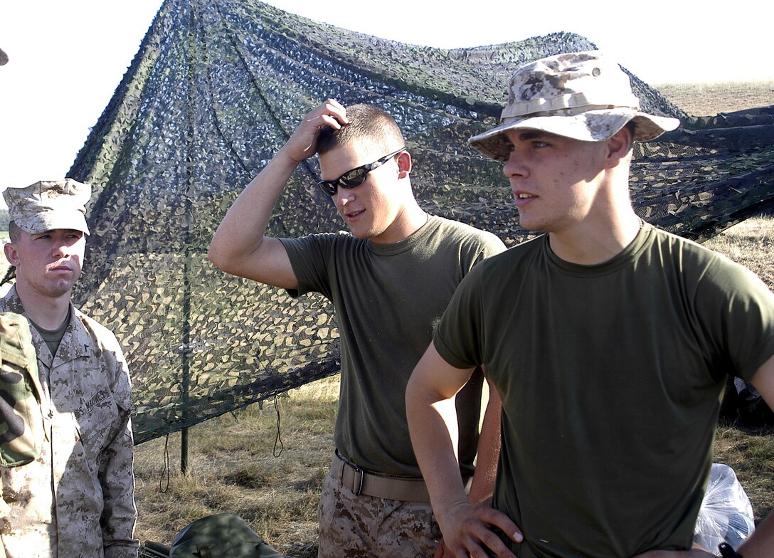 Pfc.'s Andrew N. Deeb, Chris J. McConnell and Brandon Schmitt, all riflemen with Co. L, 3/25, make up a small portion of the junior Marines of the battalion, but they all share one thing in common; they all joined the Marines to better themselves and their families. Here in support of IR08, they are working at the ammo supply depot, helping H&S Co. distribute ammunition for the joint exercise. Official photo by Cpl. Johnathan D. Herring.