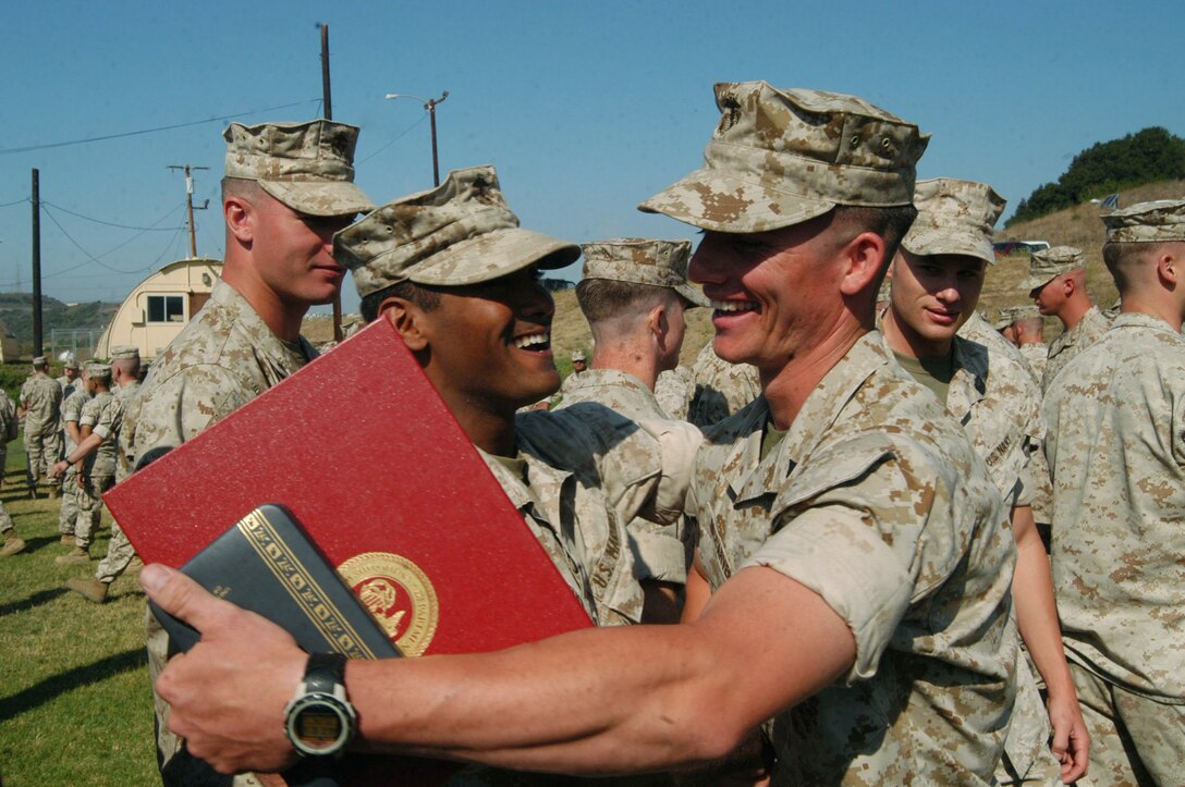 Cpl. Abraham McCarver, a Rifleman with 1st Battalion, 5th Marines , celebrates with his fellow marines after receiving a silver star Oct. 12. The Memphis,Tenessee native was awarded the silver star for his actions in Iraq during his 6- month deployment in 2004.