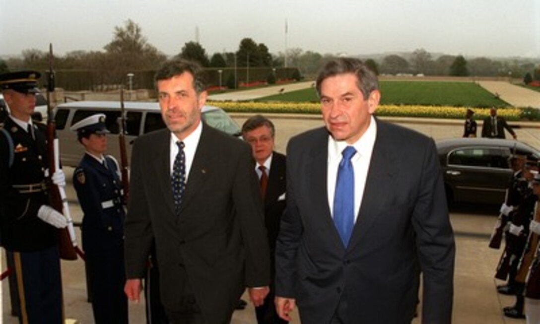 Deputy Secretary of Defense Paul Wolfowitz (right) escorts Finnish Minister of Defense Jan Erik Enestam into the Pentagon on April 12, 2002. The two defense leaders are expected to discuss a range of regional and global security issues of interest to both nations. 