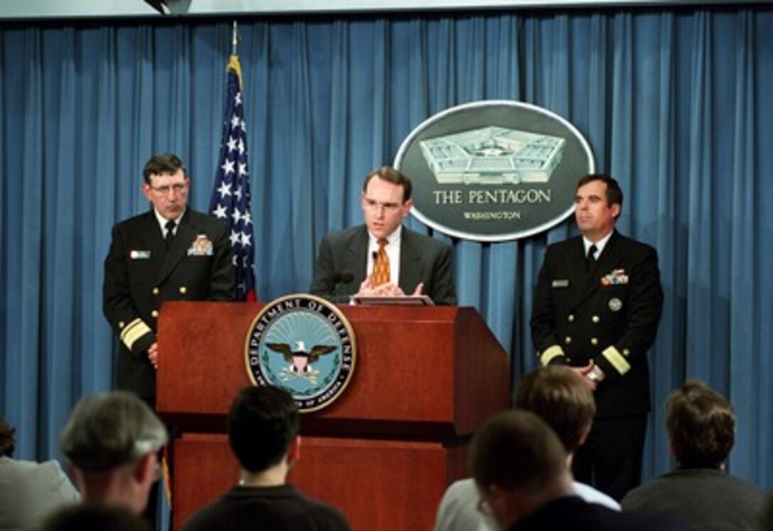 Assistant Secretary of the Navy for Research, Development and Acquisition John Young Jr. announces the Navy's decision to award the contract to Ingalls Shipbuilding, Inc., as the DD(X) lead design agent during a Pentagon press briefing on April 29, 2002. Navy Rear Adms. Philip Balisle (left) and Charles Hamilton joined Young in the announcement. 