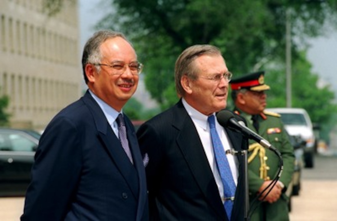 Minister of Defense of Malaysia Najib Razak (left) and Secretary of Defense Donald H. Rumsfeld conduct a joint media availability outside the Pentagon on May 2, 2002. The two leaders met to discuss defense issues of mutual interest. 